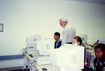 Professor Working With Students in Computer Lab