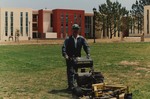 Staff Member Mowing Lawn