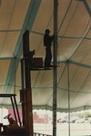 Worker Setting up Tent