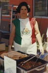 Woman Serving Food at Cinco de Mayo Celebration