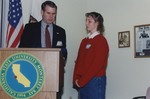 Robert L. Ord III at Podium With Student