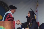 Peter Smith Shaking Hands With Graduate