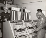 Photograph of Two Soldiers in the Communications Room
