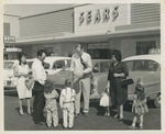 Fred Farr Greeting Families Outside of a Department Store