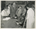 Fred Farr Observing Workers at a Fish Packing Plant, 1964