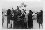 Fred Farr Handing Out Balloons and Bumper Stickers to Children