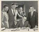 Governor Edmund "Pat" Brown Signing Legislation as Fred Farr and Three Other Men Look On