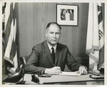Fred Farr, Seated at His Desk by Pope Studios